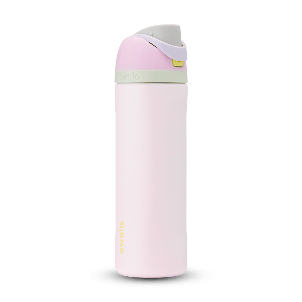 FreeSip 24oz in Candy Coated; soft pink body with pink flip cap, lavender carry loop, sage green accent band on the lid, and yellow push-button